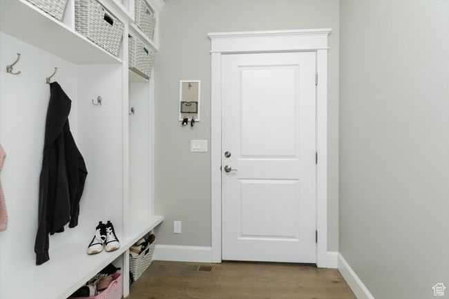 Mudroom with baseboards and wood finished floors | Image 37