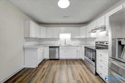 Updated Kitchen, New Stainless Appliances, Counter Tops and Tile Back Splash | Image 3