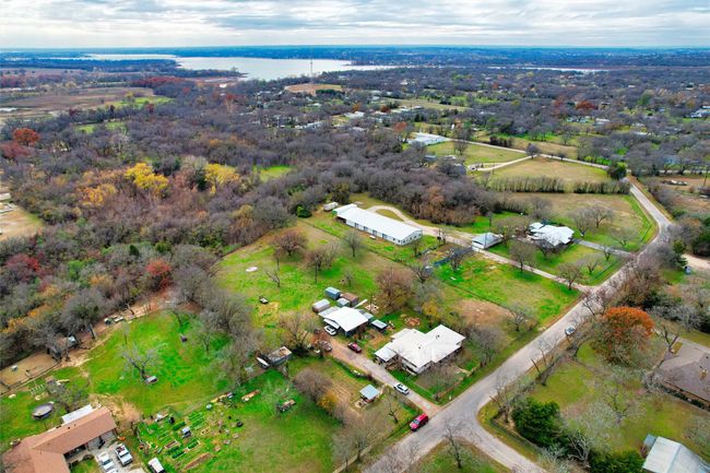 Aerial overview of property's location with a nearby body of water | Image 24