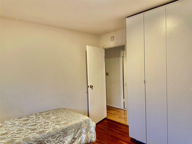 Bedroom featuring dark hardwood / wood-style floors | Image 16
