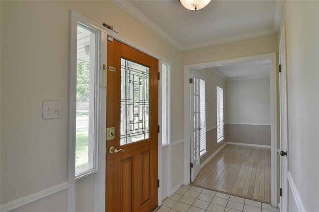 Entryway welcomes you to the living room or dining room. | Image 4