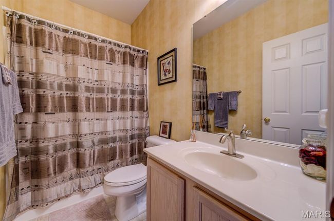 The second full bathroom is for guests and has a shower-in-tub. | Image 25