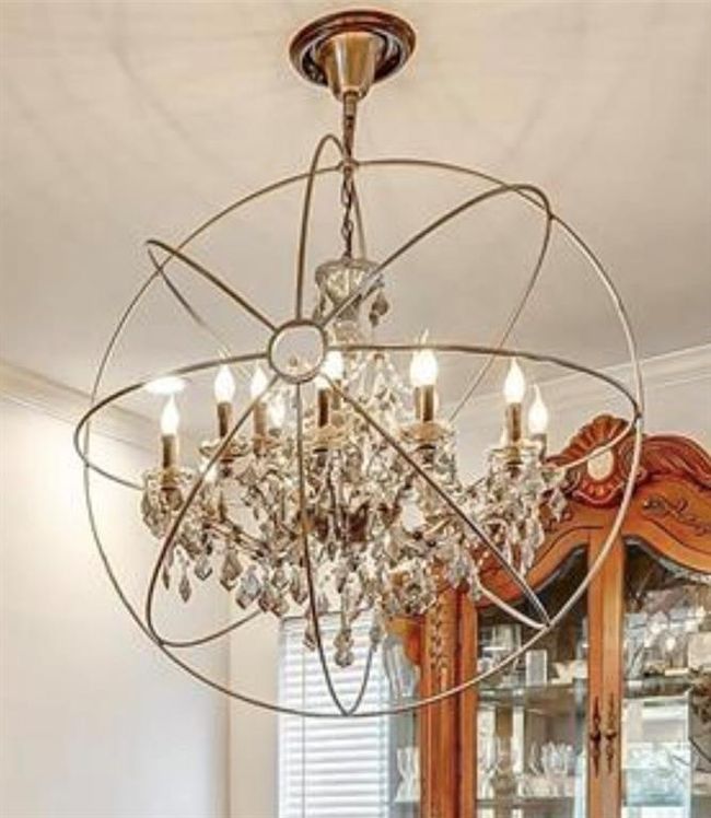 This stunning chandelier adds elegance and charm to the dining area. | Image 9