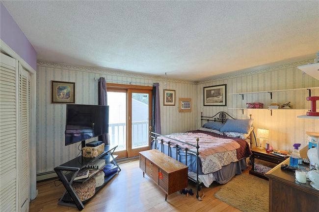 Bedroom featuring access to balcony, a large closet | Image 10