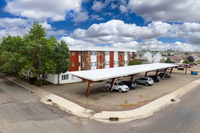 View of car parking featuring a carport | Image 1