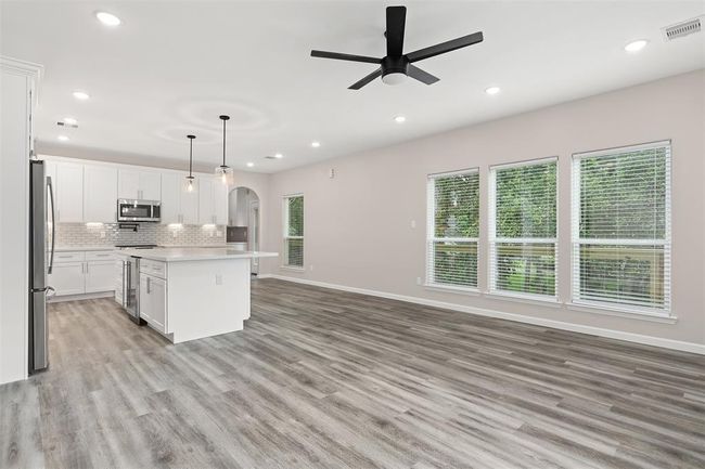 View of the living room and kitchen from the front door | Image 4