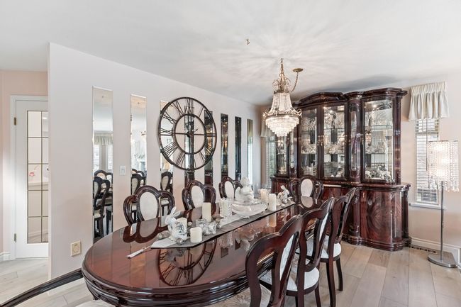 Dining room featuring a chandelier, baseboards, and light wood finished floors | Image 6