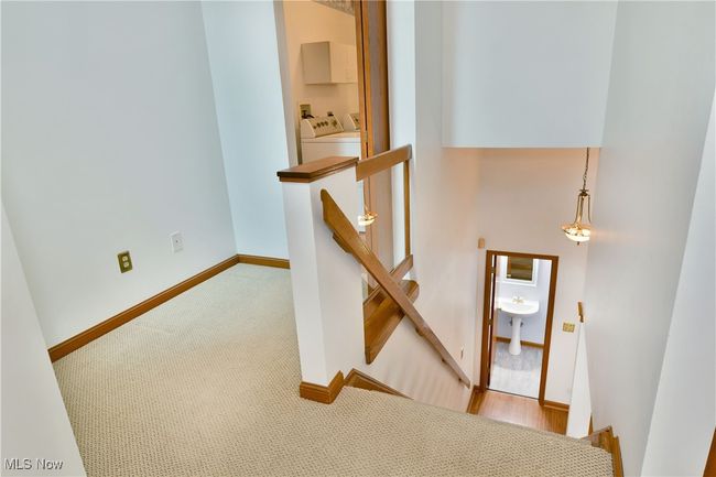 Staircase with carpet and baseboards | Image 21