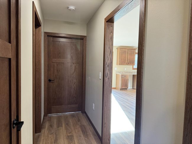 Cental hallway connects 2nd and 3rd bedrooms to shared bath, linen closet & living areas. | Image 11