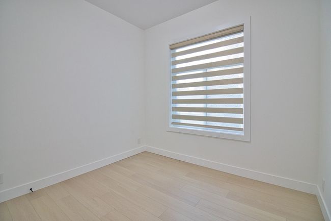 Empty room featuring healthy amount of natural light, light wood-style floors, and baseboards | Image 23