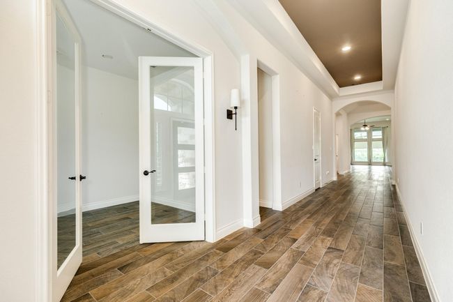 Left side of the property consists of two beds and a bath, followed by a grand entrance with an office on the left. | Image 5