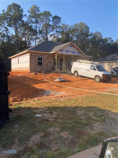 View of front of house with a garage | Image 1