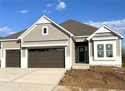 View of front of home featuring a garage | Image 1