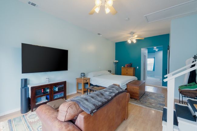 Seating area and bed of the Primary Suite | Image 11