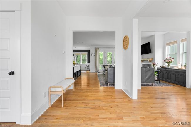 Corridor featuring light wood-type flooring and baseboards | Image 6