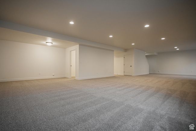 Basement featuring light carpet | Image 26