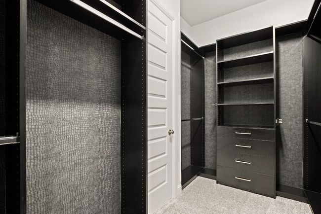 Walk in closet featuring carpet floors | Image 13