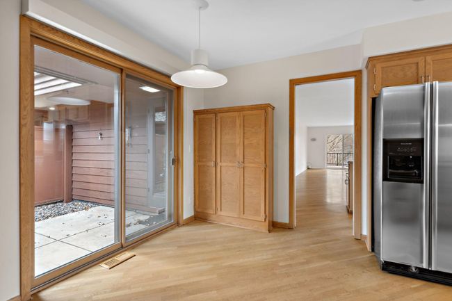 Sliding door from kitchen walks out to patio | Image 7