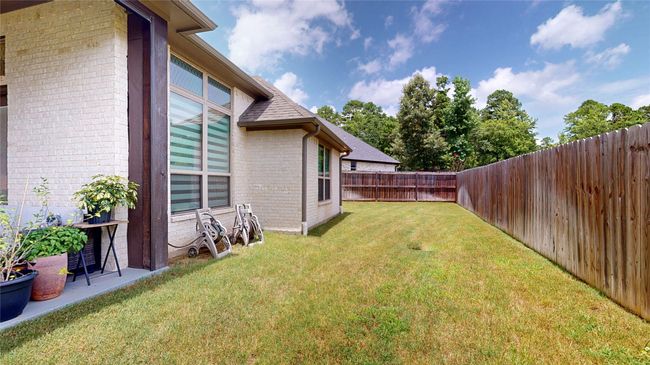 View of fenced backyard | Image 36