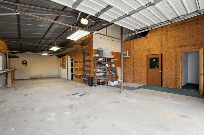 Garage featuring a garage door opener | Image 34