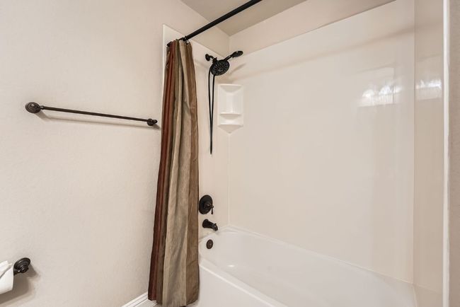 Full bathroom with shower / tub combo with curtain | Image 31