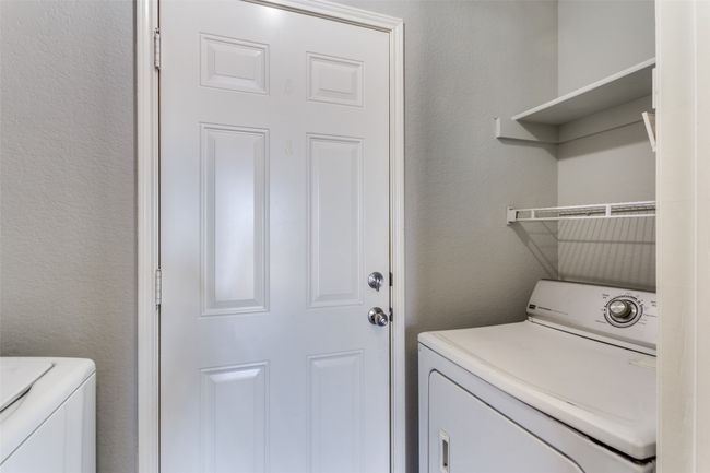 Laundry room featuring independent washer and dryer | Image 15