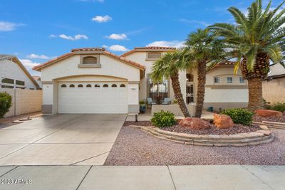 This lovely 2393sf Phoenician model has great curb appeal and is located in the 55+ active adult resort community of Arizona Traditions. | Image 1