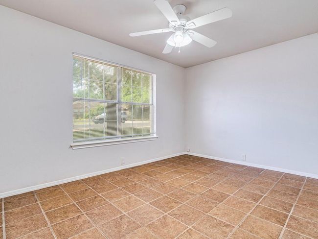 Empty room featuring baseboards and a ceiling fan | Image 25