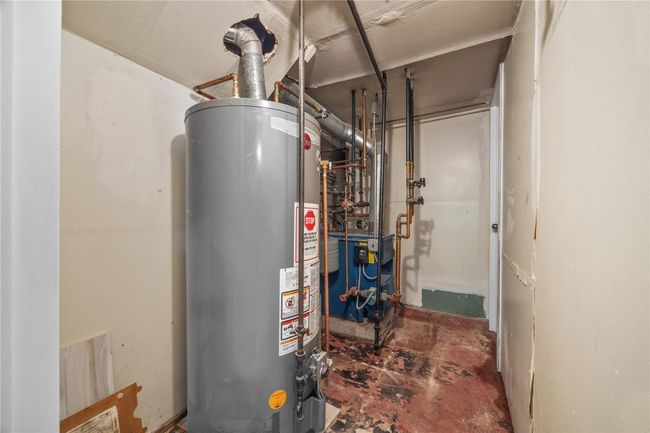 Utilities featuring gas water heater | Image 40