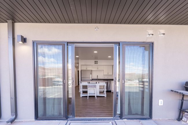 Property entrance featuring stucco siding and a sink | Image 7