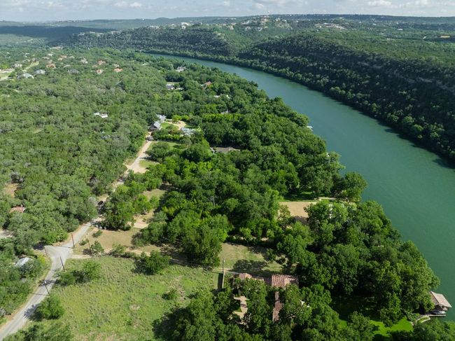View of property location featuring a forest and a large body of water | Image 30
