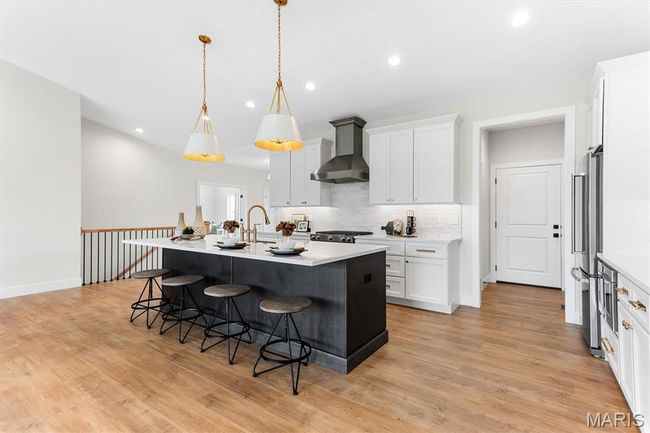 Well-designed kitchen with designer lighting and premium plumbing fixtures! | Image 30