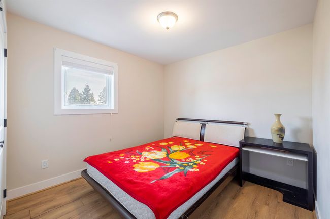 Bedroom with wood finished floors and baseboards | Image 18