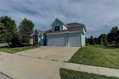 View of front of house with a garage and a front lawn | Image 2