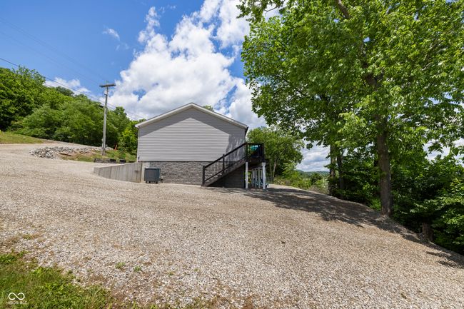 view of property exterior with stairway and central AC | Image 62