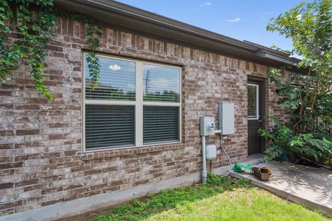 View of side of home with brick siding | Image 26