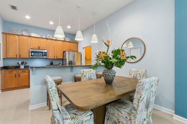 Adjacent to the kitchen, perfect for intimate dinners or entertaining guests. | Image 9