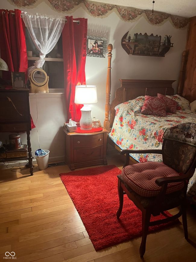 bedroom featuring wood-type flooring | Image 46