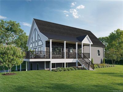 Back of house with a lawn and a deck | Image 2