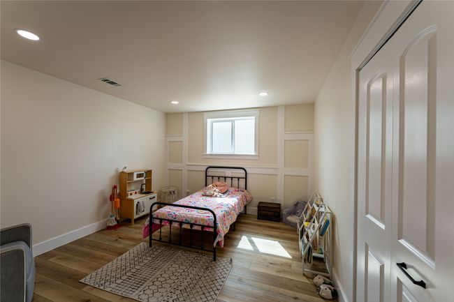 Bedroom with baseboards, visible vents, hardwood / wood-style floors, and recessed lighting | Image 12