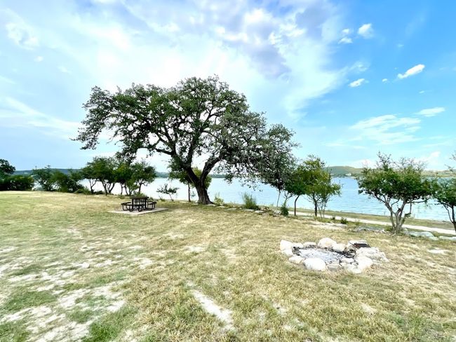 View of property's community featuring a water view and a yard | Image 14