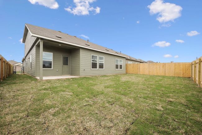 Rear view of property with a patio area and a fenced backyard | Image 34