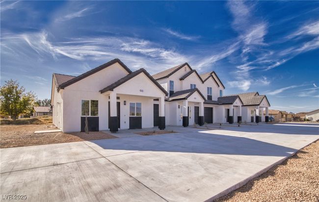 Another view of the property from the exterior, highlighting the modern design and sleek finishes that define Hardy Manor on Erin. | Image 18