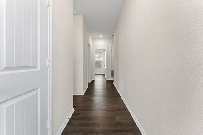 Hall featuring dark wood-style flooring and recessed lighting | Image 21