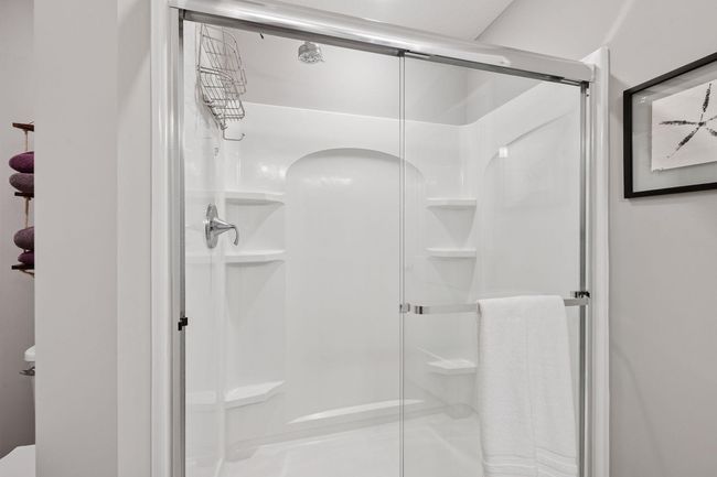 You'll find a walk-in shower in the primary bathroom | Image 25