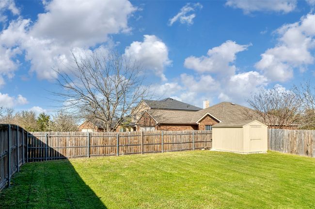 Great View of Big yard with a storage unit, and a fenced private backyard | Image 33