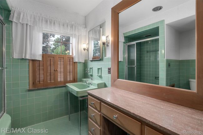 Ceramic tile and spacious vanity in primary bath | Image 18