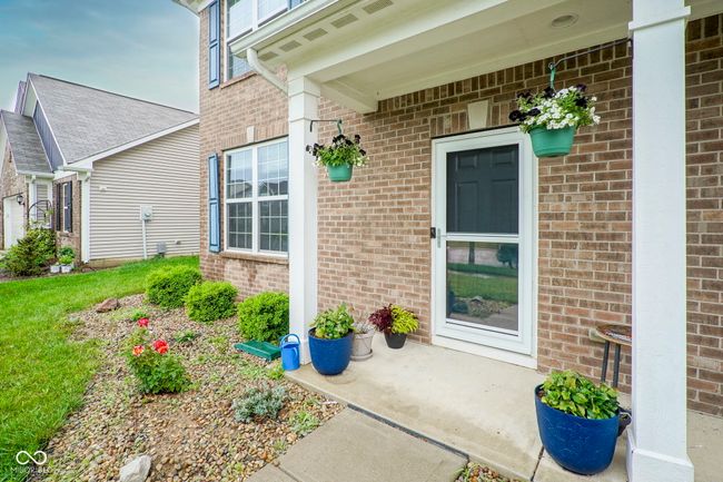 view of exterior entry featuring brick siding | Image 4