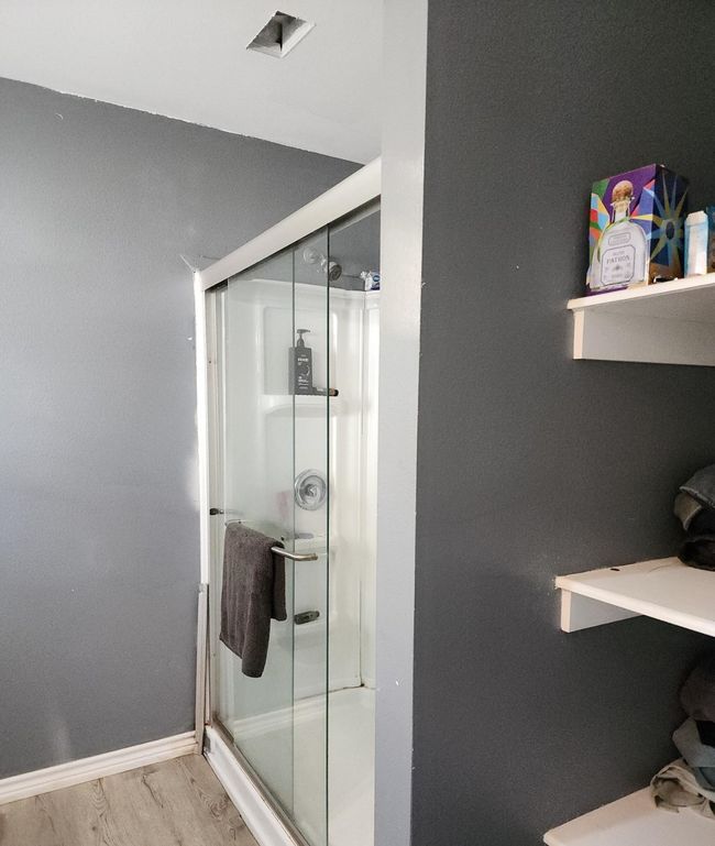Primary Bathroom with Shower, storage, single sink vanity and closet | Image 9