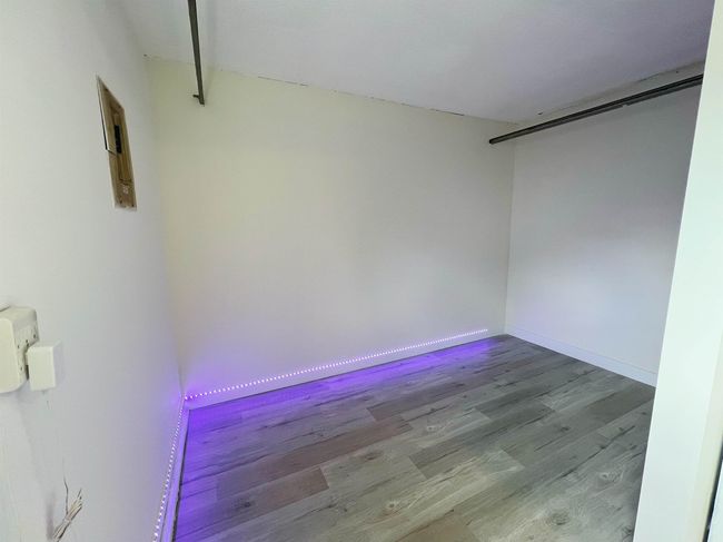 Empty room featuring wood finished floors and baseboards | Image 8